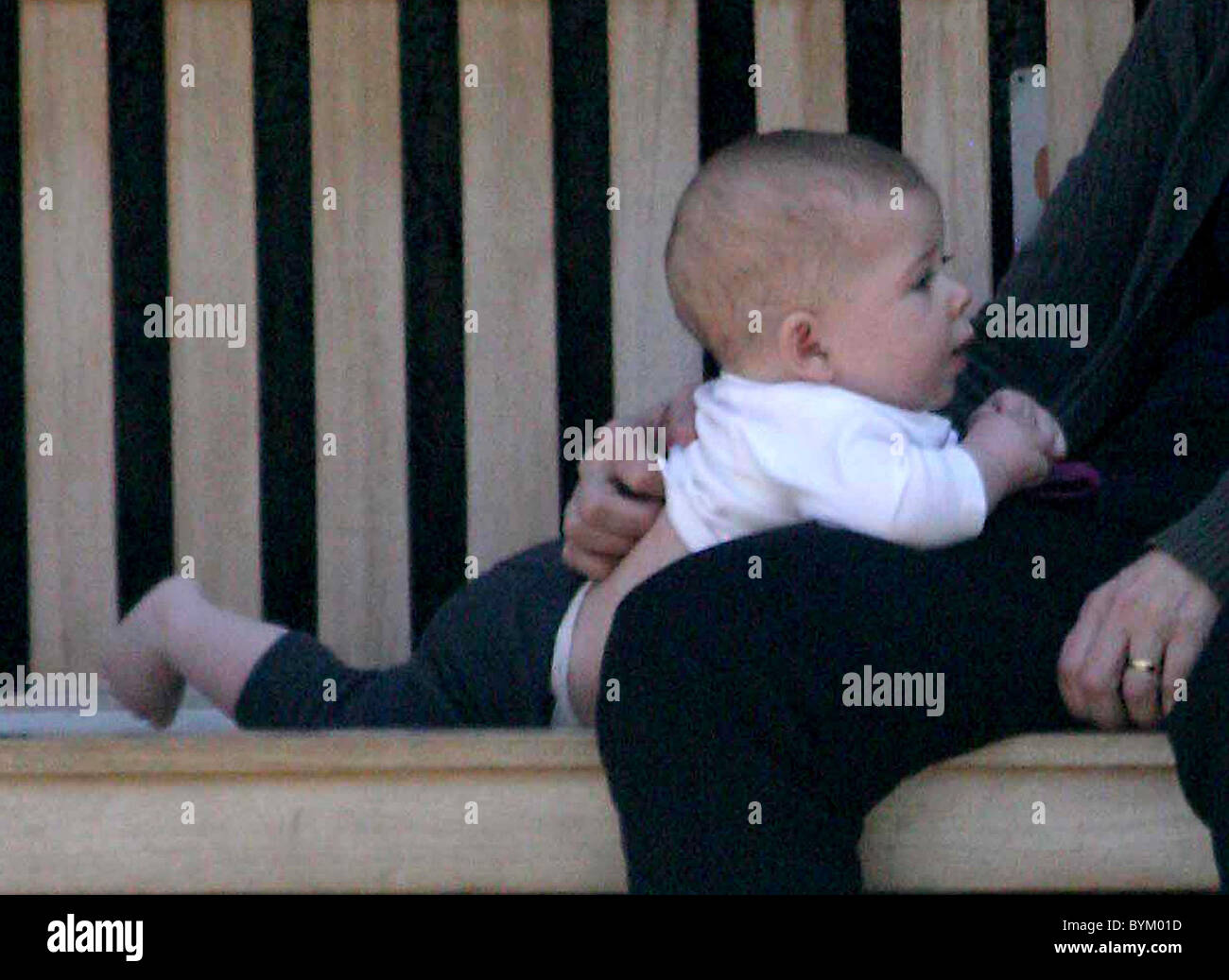 Maggie Gyllenhaal's daughter Ramona Sarsgaard plays with her grandmother Naomi Foner before lunch in the West Village New York Stock Photo