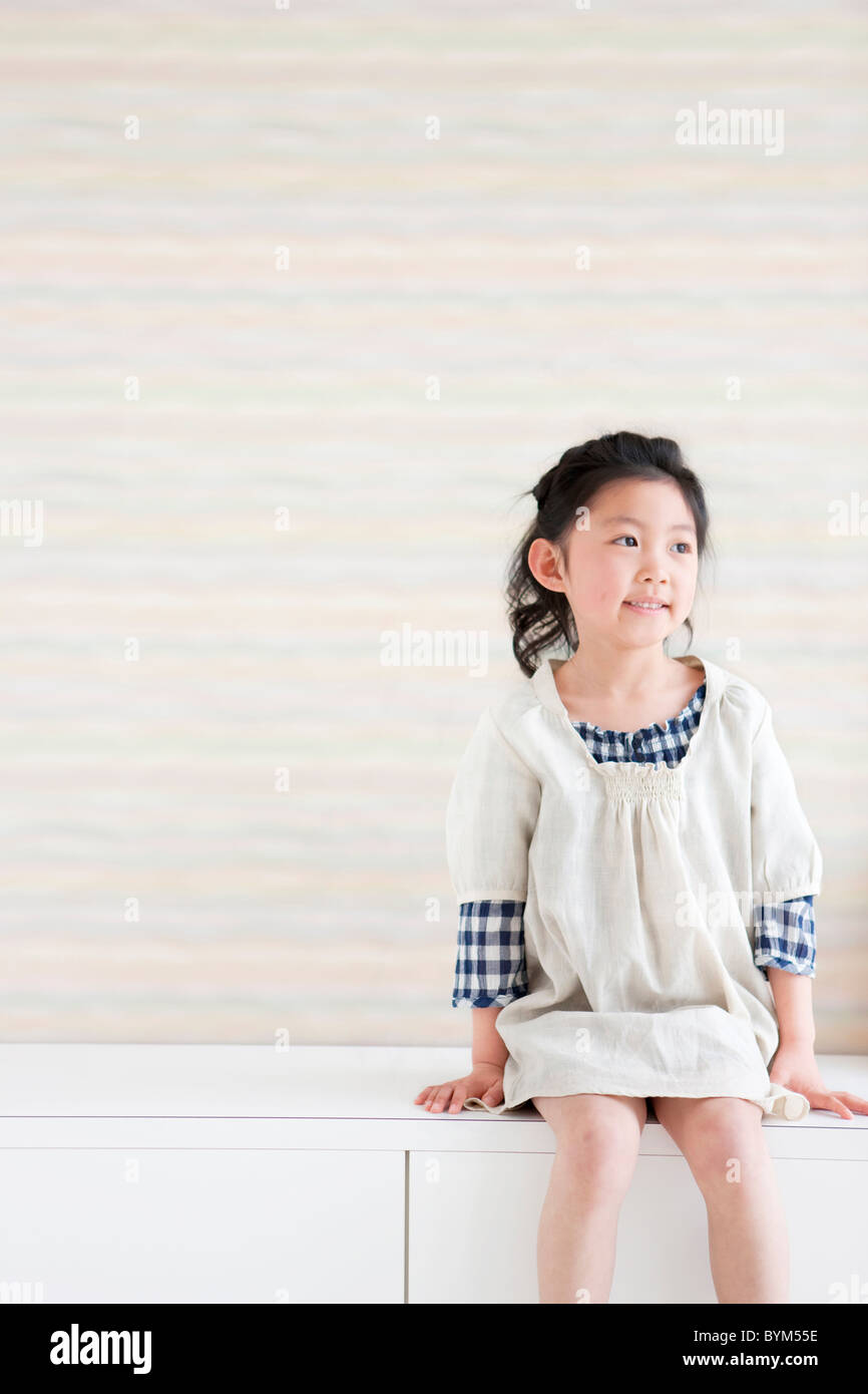 Girl sitting on bench hi-res stock photography and images - Alamy