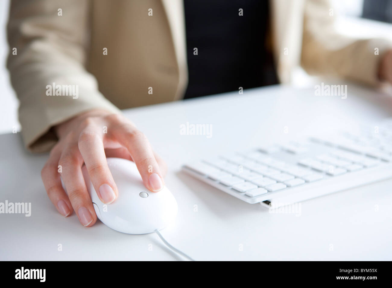 Hand of woman using a computer mouse Stock Photo - Alamy
