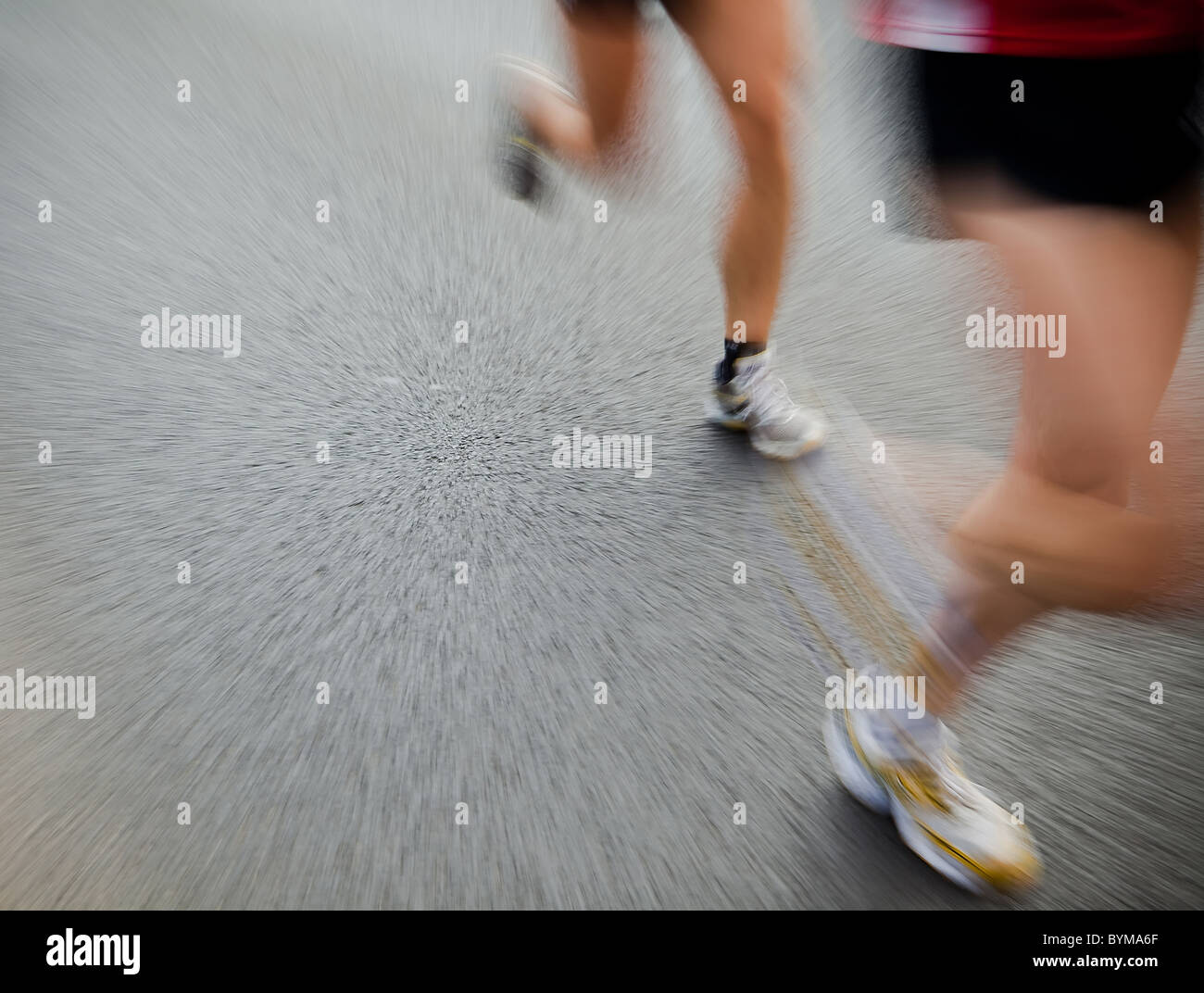 Man running in city marathon Stock Photo