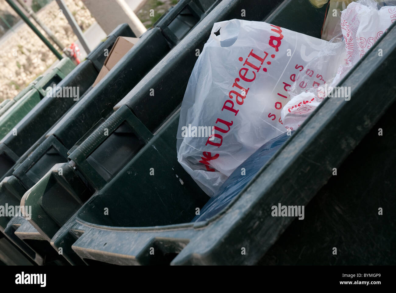 Closeup of plastic bag with French writing in a recycle bin Stock