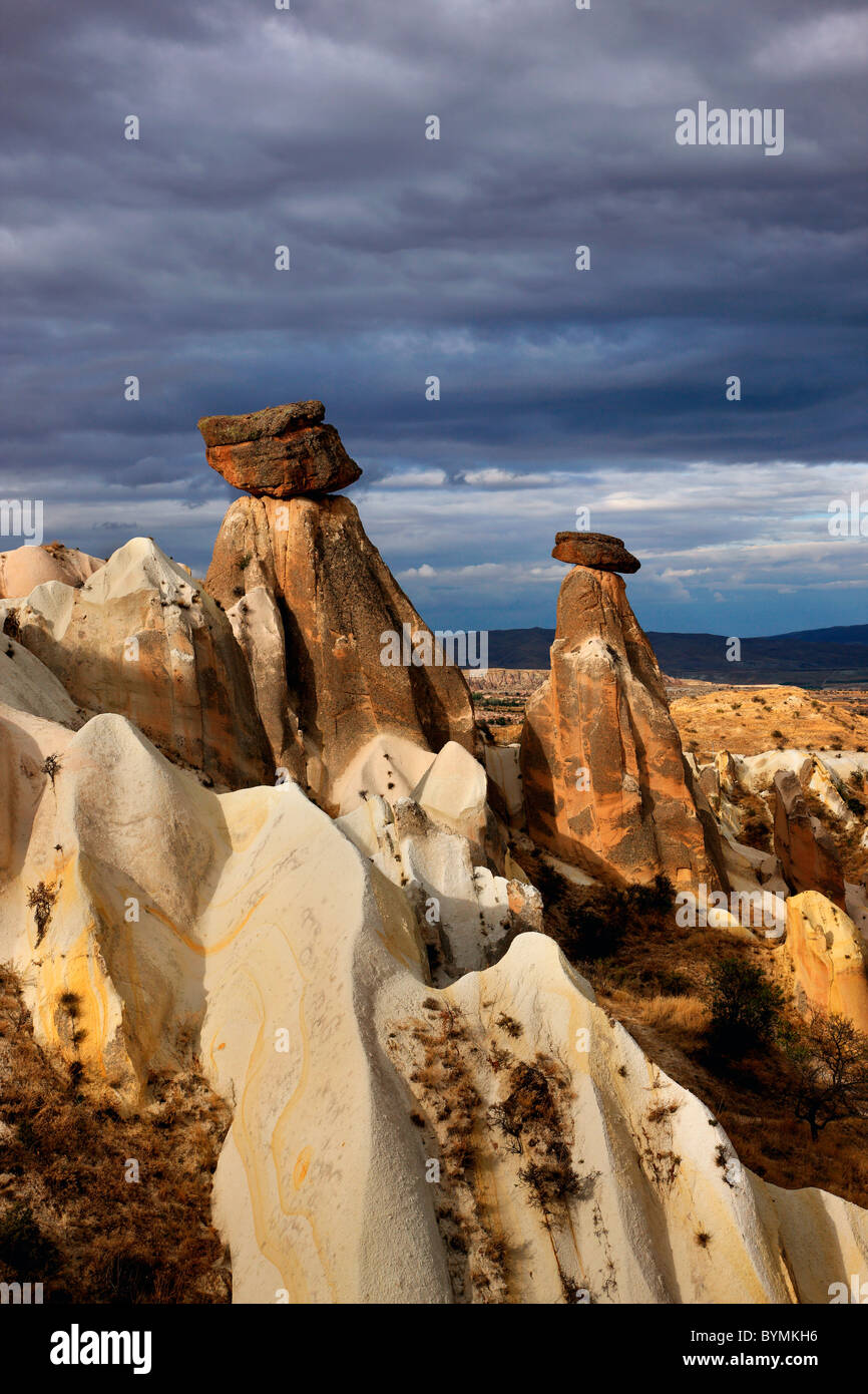 Two of the most famous 'fairy chimneys' of Cappadocia, close to Urgup, on the road to Goreme. Turkey Stock Photo