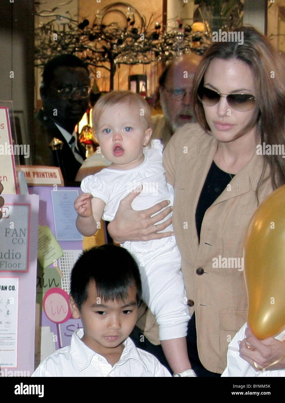 Shiloh Jolie-Pitt Angelina Jolie and family shopping for a Father's Day present at 'Lee's Art store' New York City, USA- Stock Photo