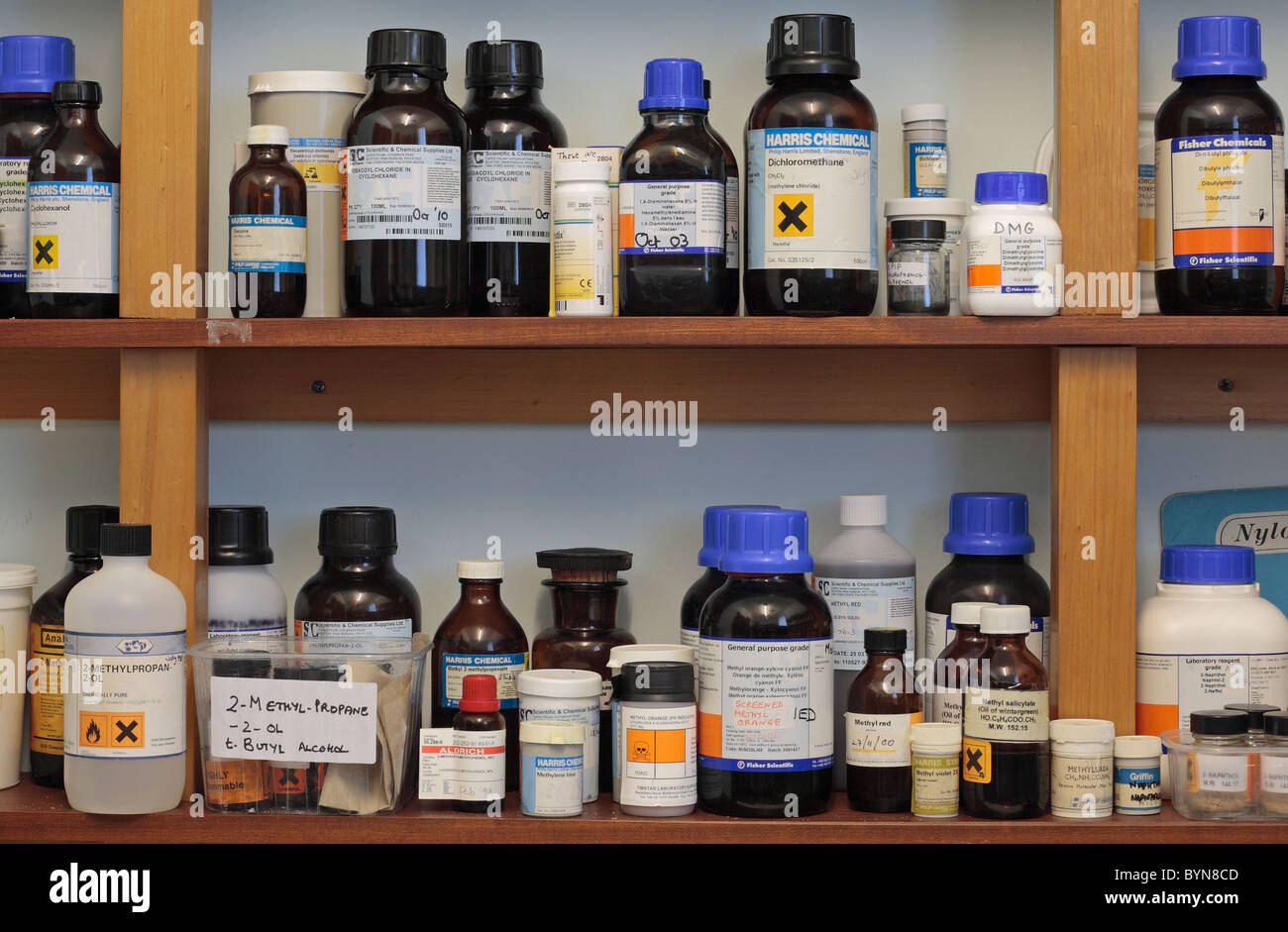 Shelves of assorted chemicals in a school chemical storage room in