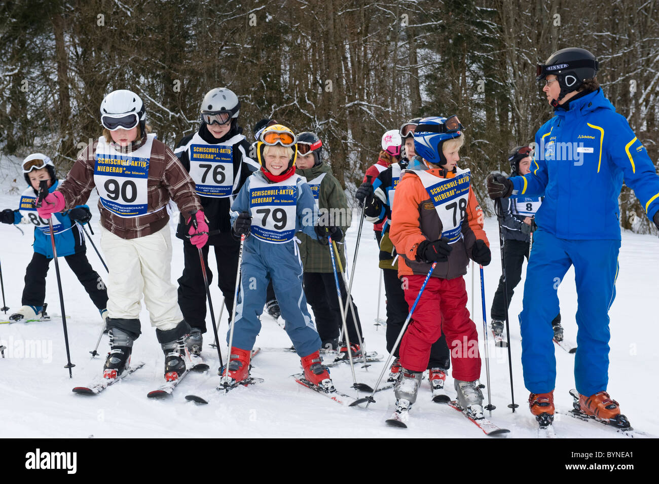 Children with instructor attending a ski course in Niederau in Austria Stock Photo