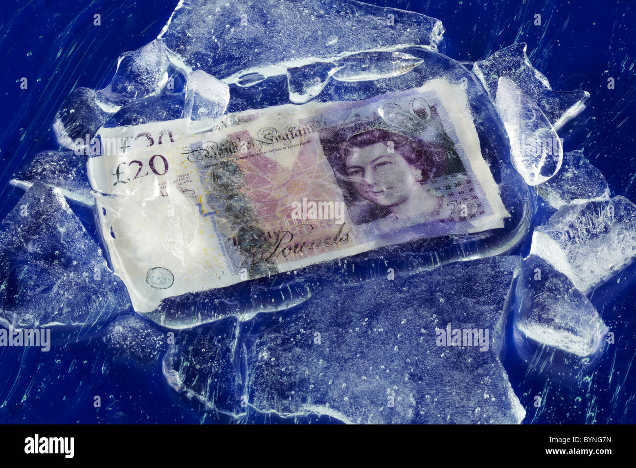 Twenty Pound Notes Frozen on Ice Stock Photo - Alamy