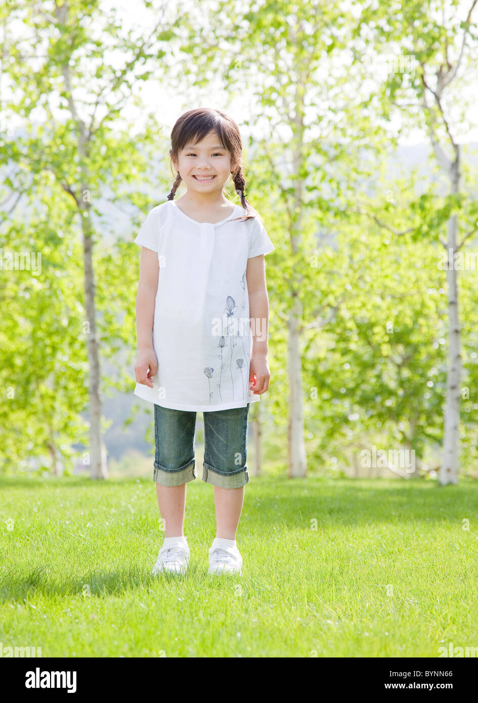 Girl Standing Portrait Looking At Camera Smiling Stock Photo - Alamy