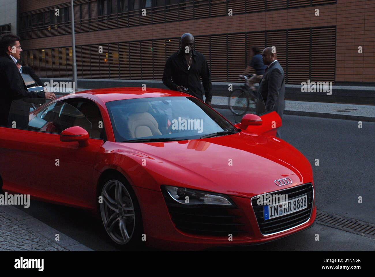 Seal leaving the Hyatt Hotel and driving off in a red Audi R8 sports ...