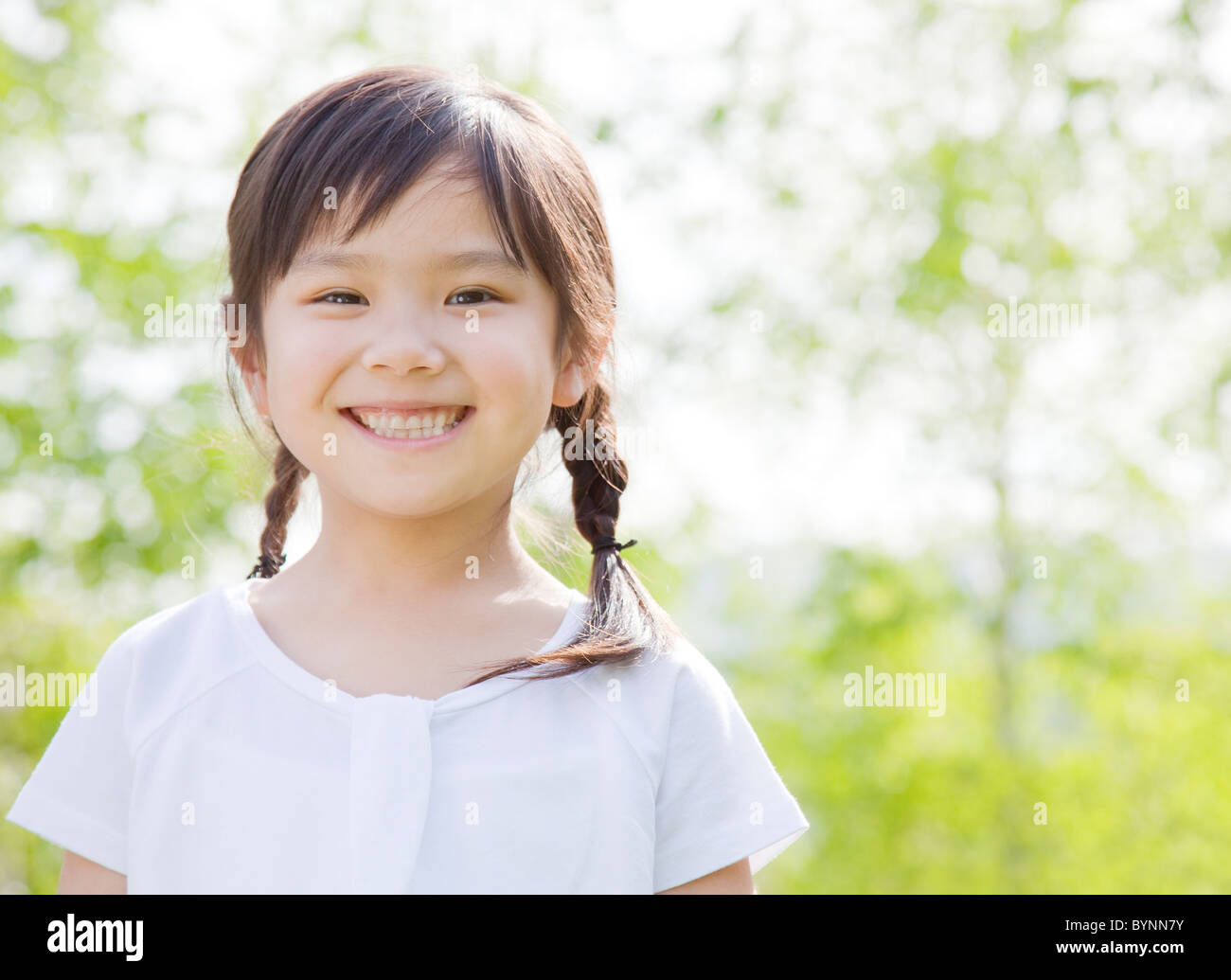 Girl Standing Portrait Looking At Camera Smiling Stock Photo - Alamy