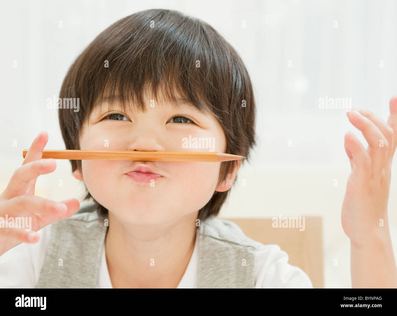 Boy Pencil Human Lips Making A Face Balance Stock Photo