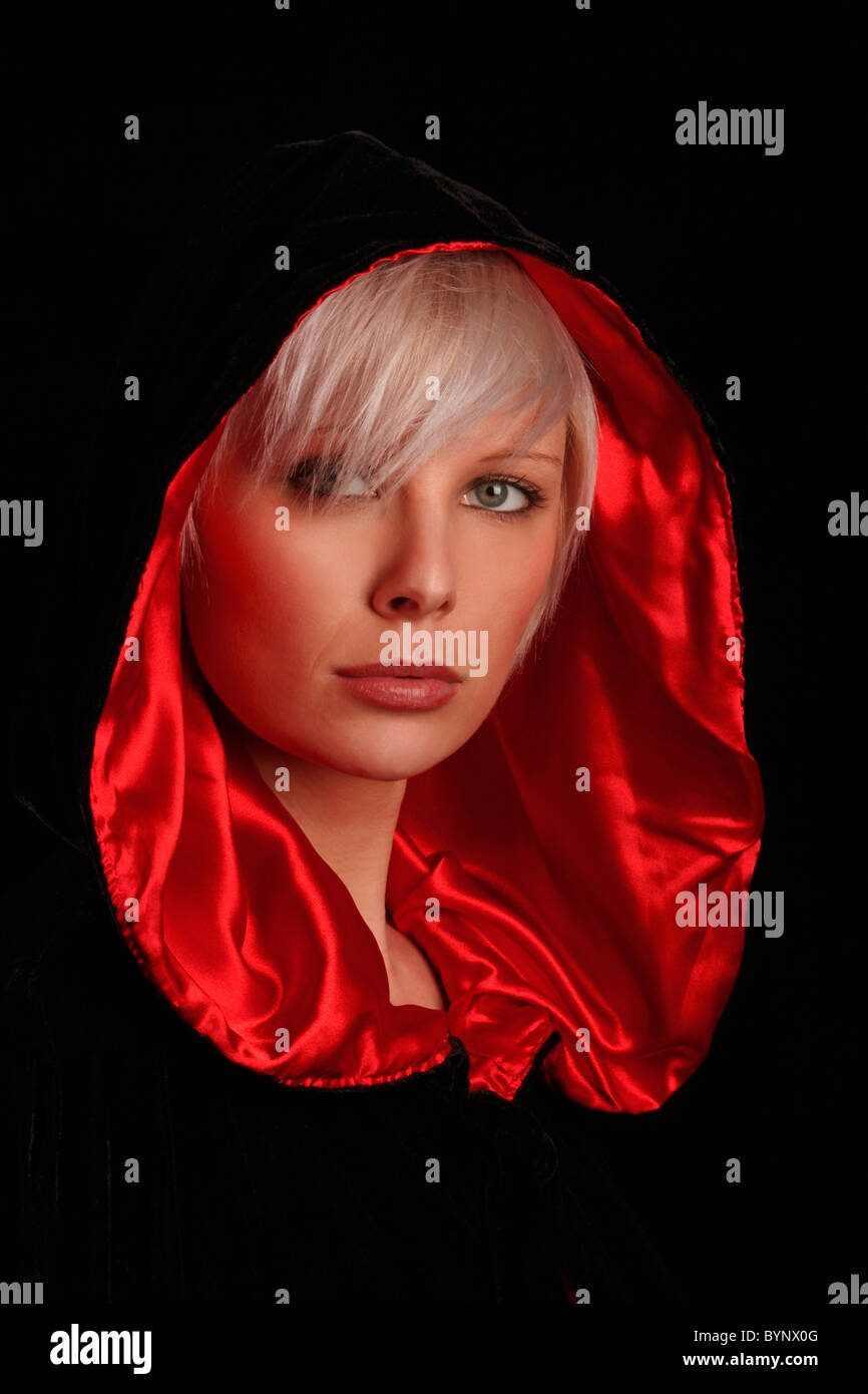 Young Silver Haired Woman Wearing A Red Lined Black Cloak Stock