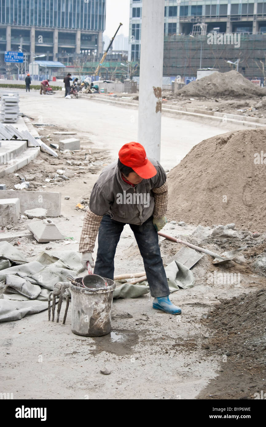 Female laborer at a construction site in Shanghai, China Stock Photo