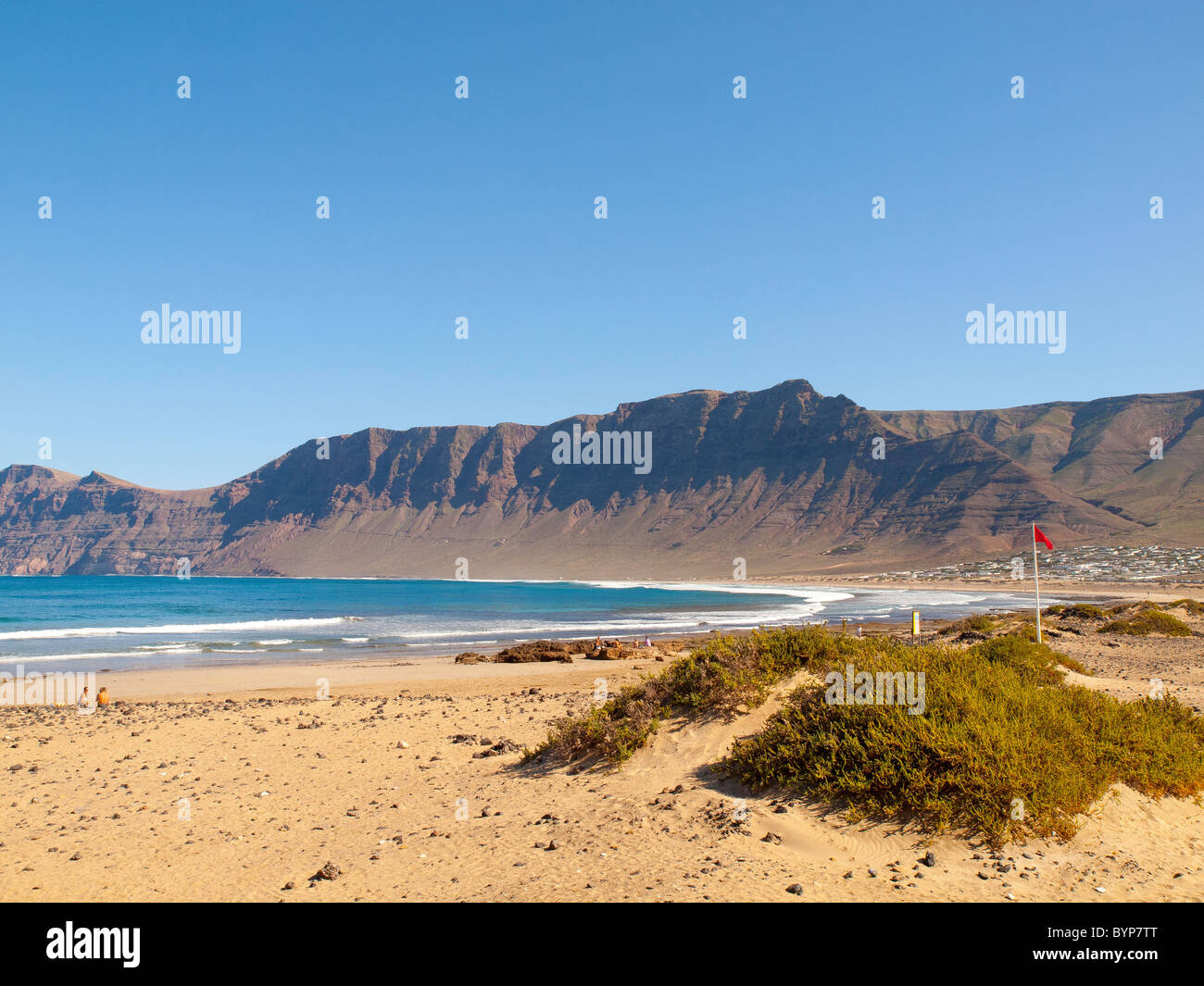 Playa de Famara beach with surf on the undeveloped North West coast of Lanzarote Canary Islands Stock Photo