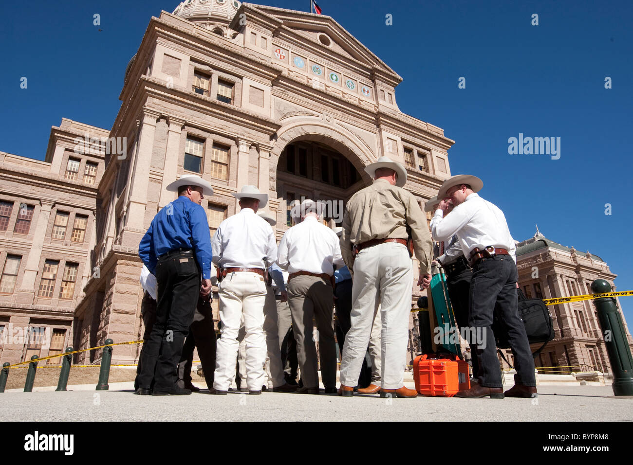 Texas Rangers gather evidence on the south steps of the Texas Capitol on Thursday after a man fired several shots on the grounds Stock Photo