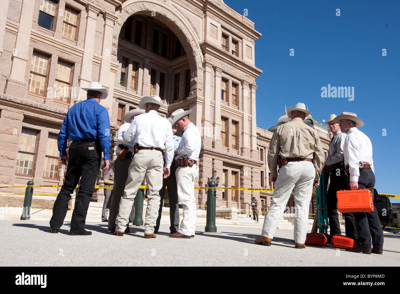Texas Rangers gather evidence on the south steps of the Texas Capitol on Thursday after a man fired several shots on the grounds Stock Photo