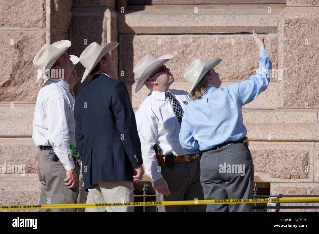 Texas Rangers gather evidence on the south steps of the Texas Capitol