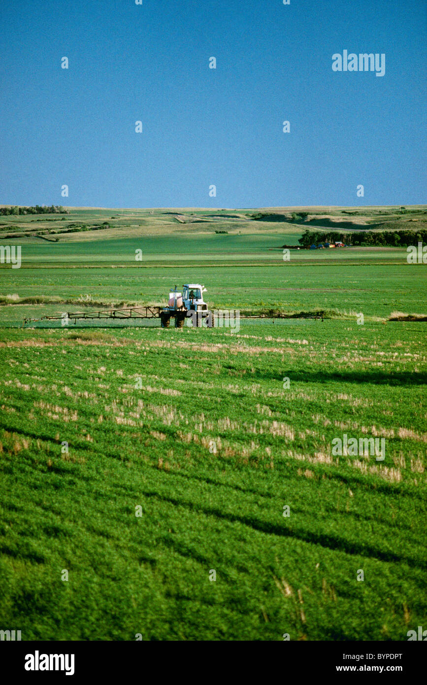 A self contained spray vehicle applies post emergence herbicide on a