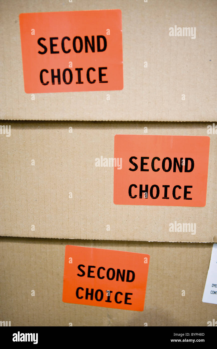 Cardboard boxes labeled with stickers reading "second choice Stock