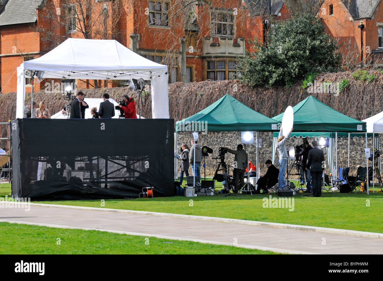 Broadcasting television news crews preparing for political interviews before 2010 General Election on Abingdon Green Westminster London England UK Stock Photo