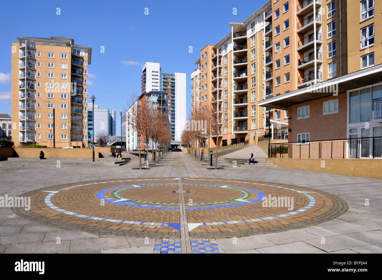 Paved landscaping & modern housing estate high rise apartment homes & flats near East India DLR station Blackwall Tower Hamlets East London England UK Stock Photo