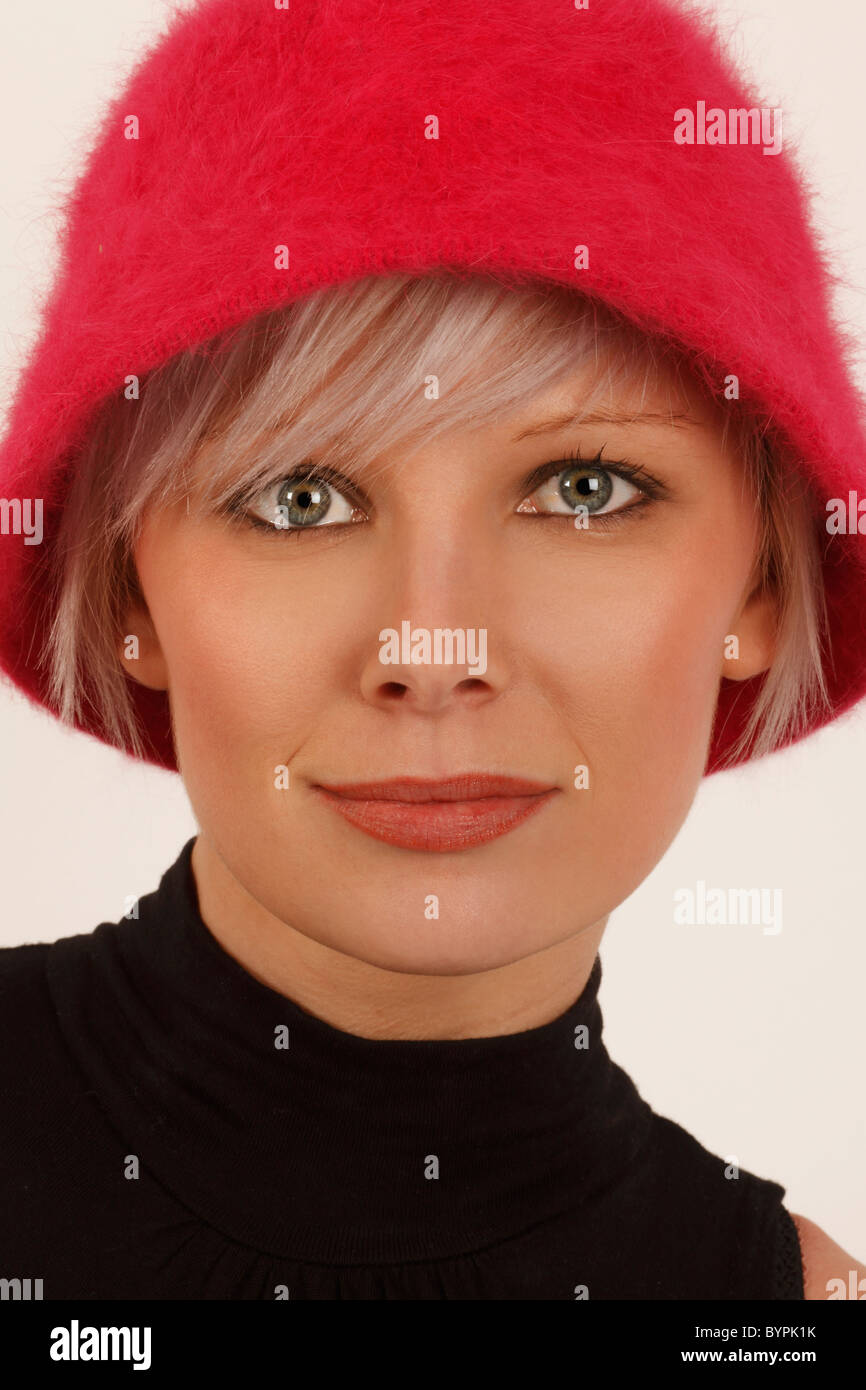 Young Woman With Silver Hair Wearing A Pink Furry Hat Stock Photo