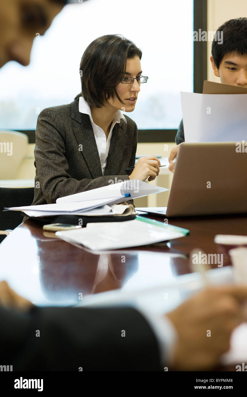 Executives working together at conference table Stock Photo Alamy