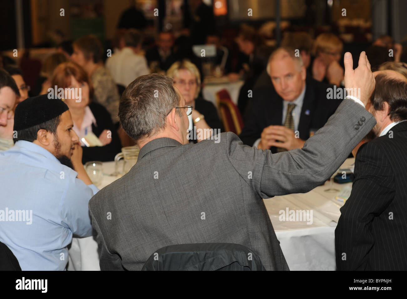 group of mixed race people talking at a public council meeting Stock ...