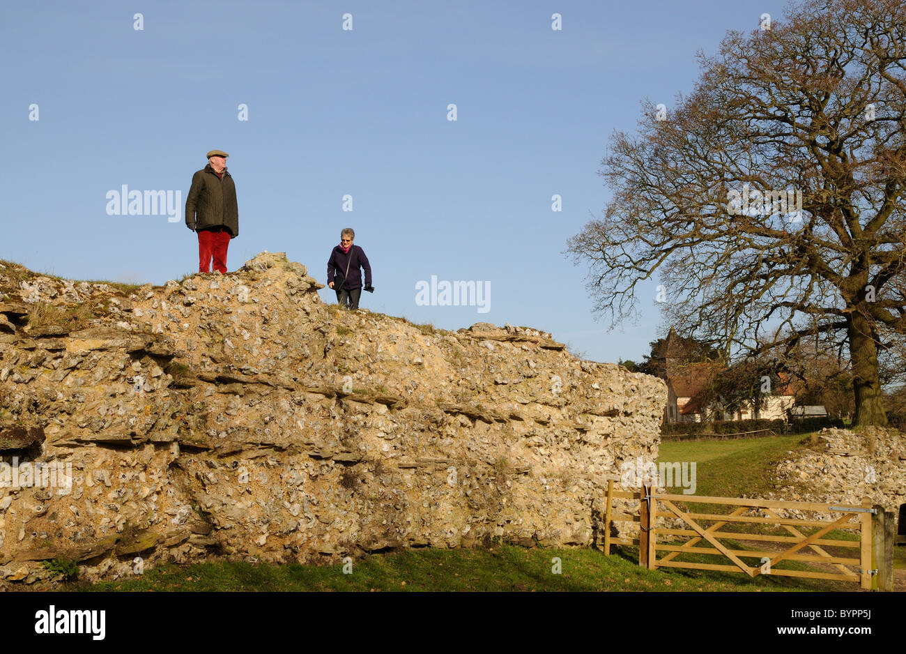Roman wall at Silchester in Hampshire southern England Visitors walking
