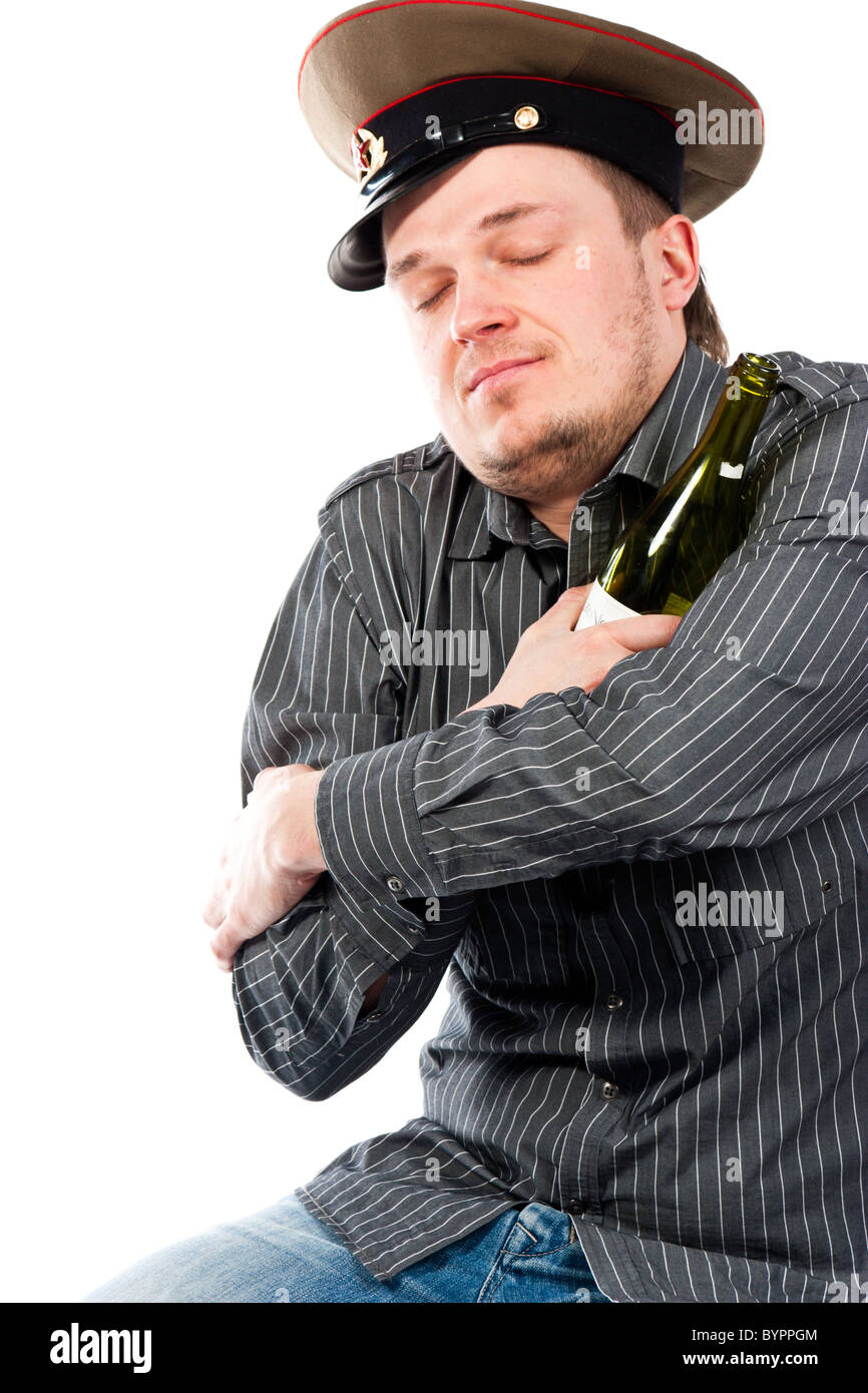 Portrait of a drunk man hugging a bottle isolated on white Stock Photo