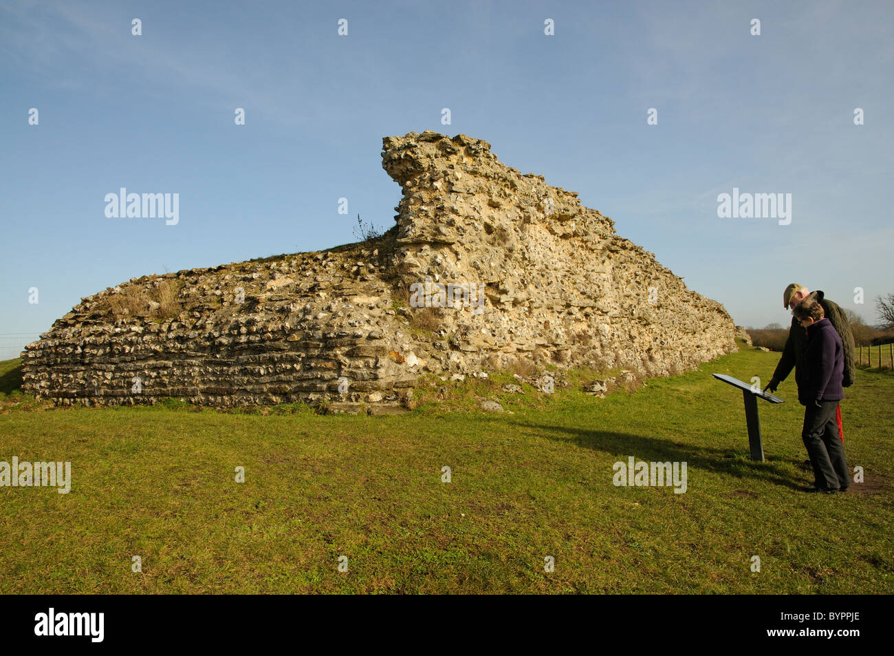 Roman wall at Silchester in Hampshire southern England Visitors reading