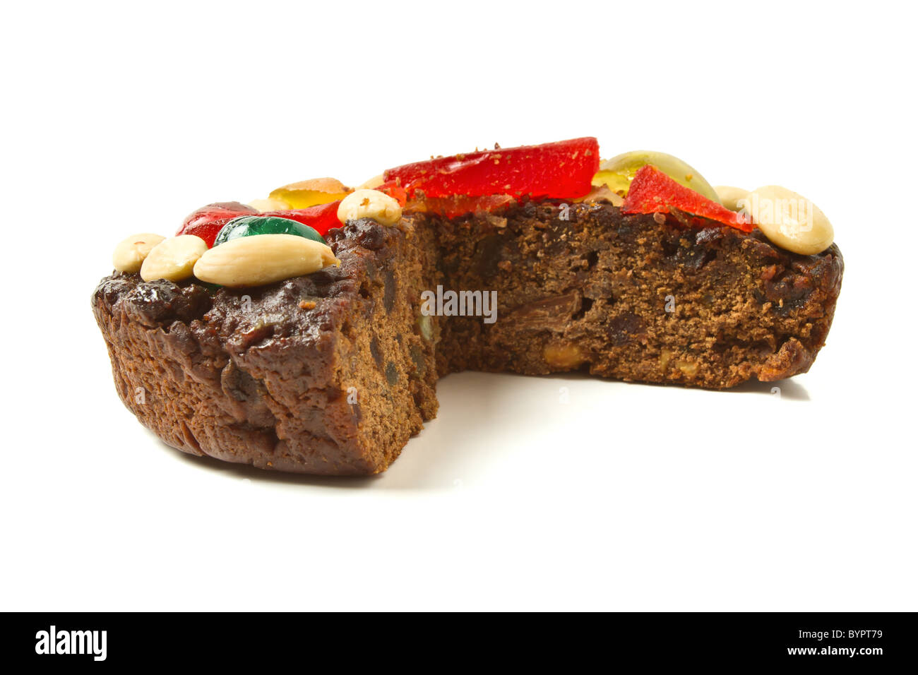 Italian Chocolate Fruit Cake topped with nuts and glace fruits. Stock Photo