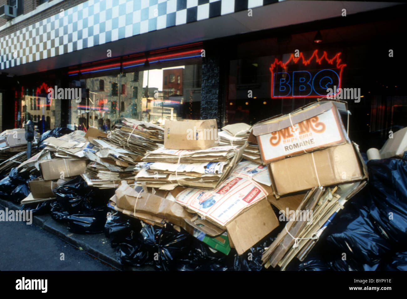 Bags of trash and recyclables await pickup in the Greenwich Village
