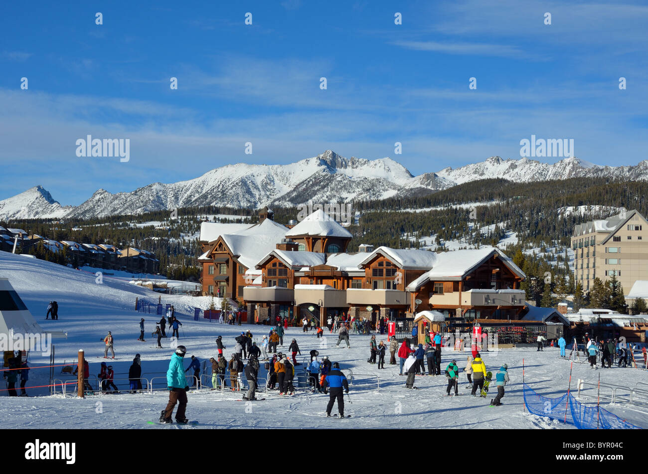 Skiers coming down the slope to village center. Big Sky Ski Resort, Montana, USA Stock Photo Alamy