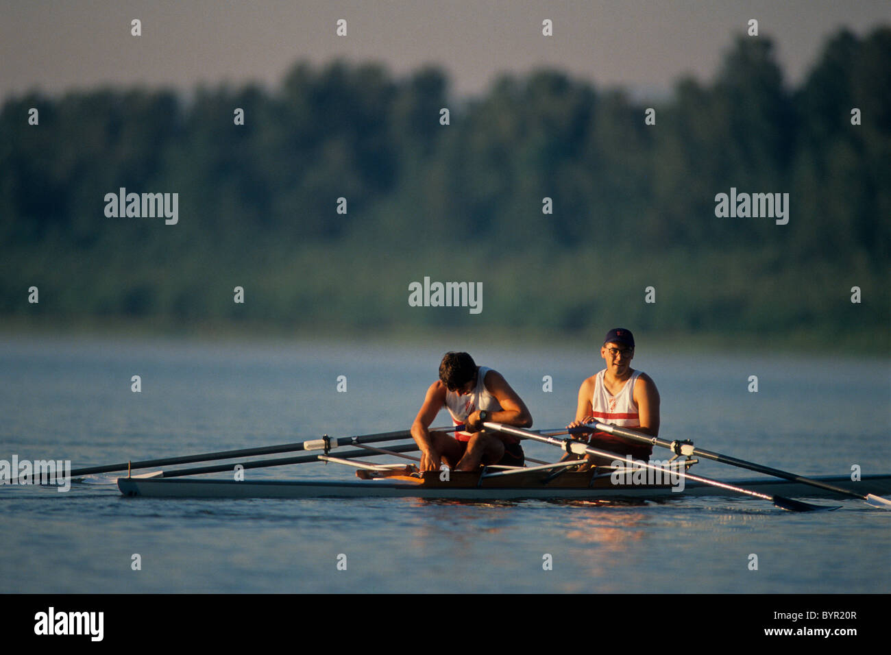 Rowing pairs team exhausted after racing Stock Photo - Alamy