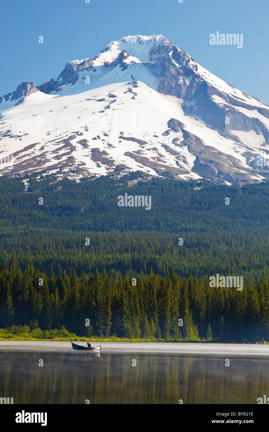 boating in trillium lake with mount hood in the background in the ...