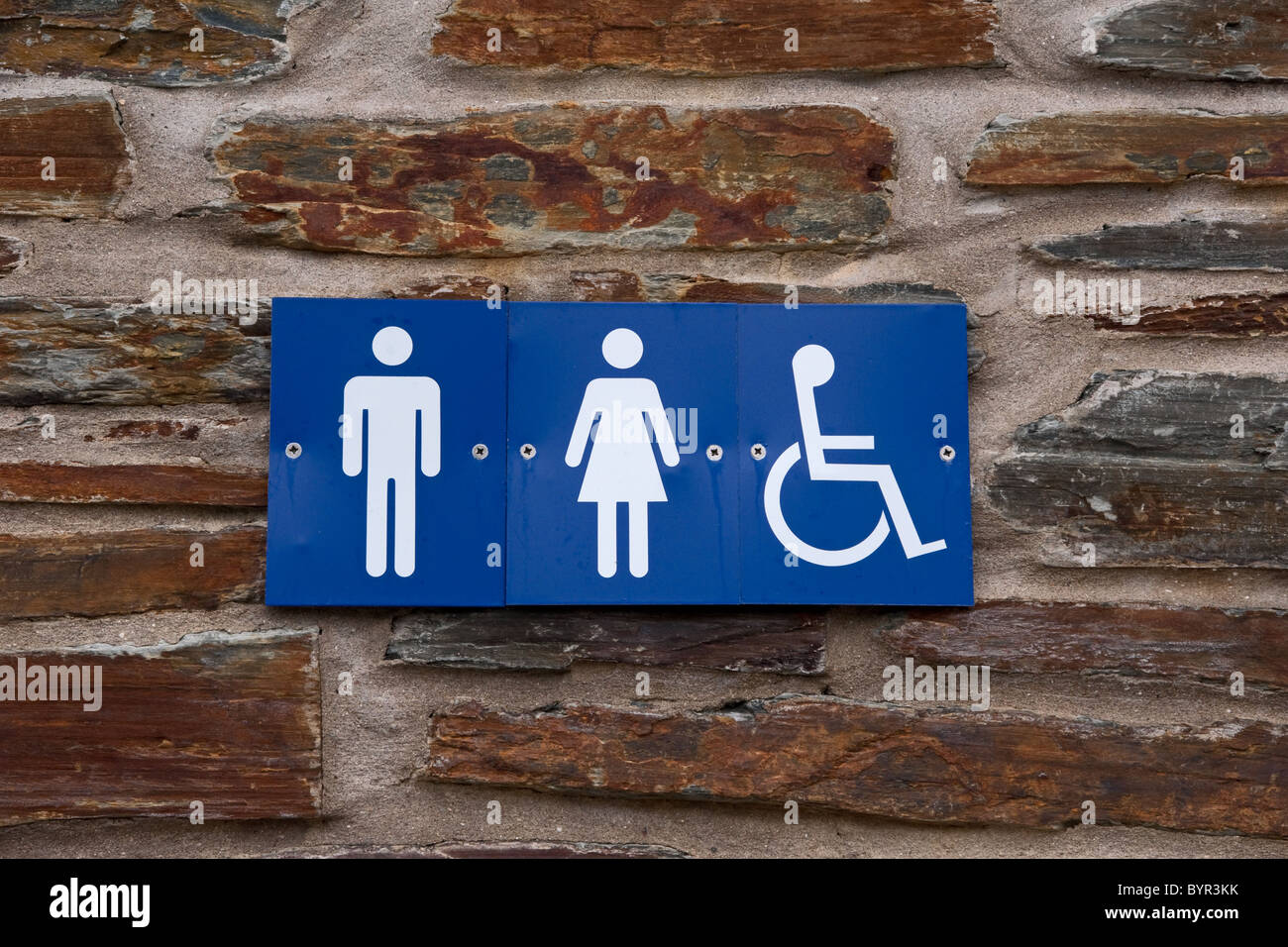 Metal sign on wall of a public toilet Stock Photo