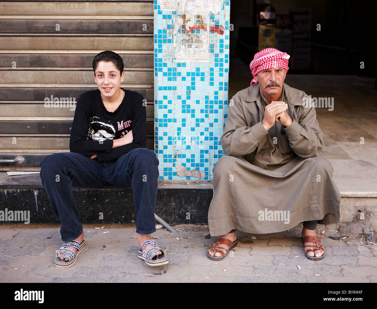 Two generations of Syrian men, side by side, Hama, Syria Stock Photo