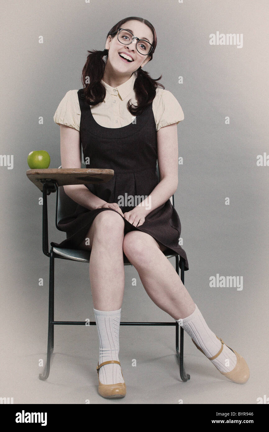 retro geeky school girl sits at her desk Stock Photo - Alamy