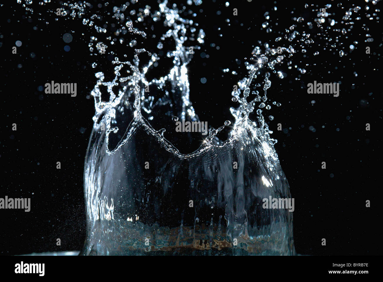 a drop of water landing and splashing Stock Photo