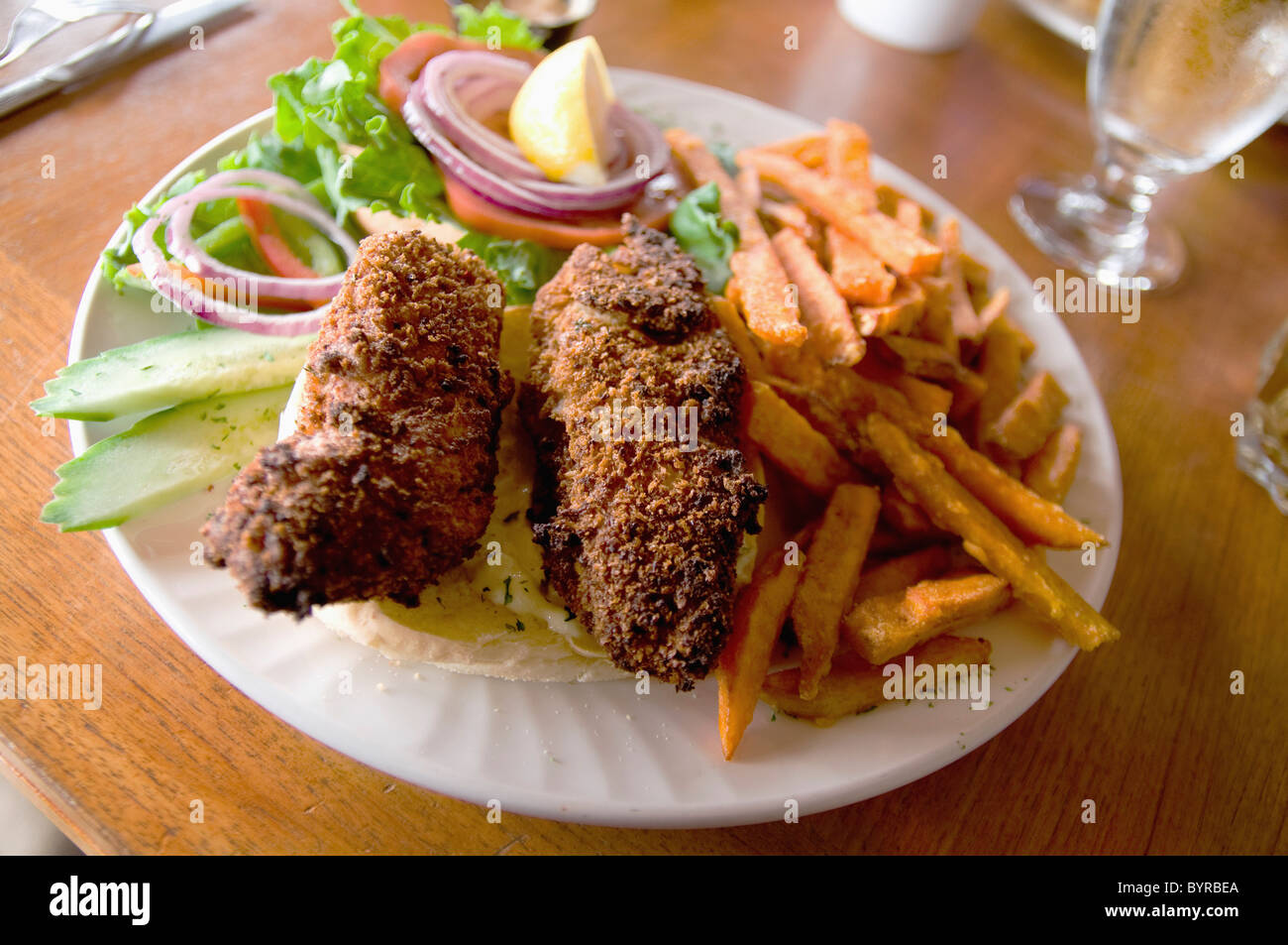 a plate of fried foods and salad; tofino, british columbia, canada Stock Photo