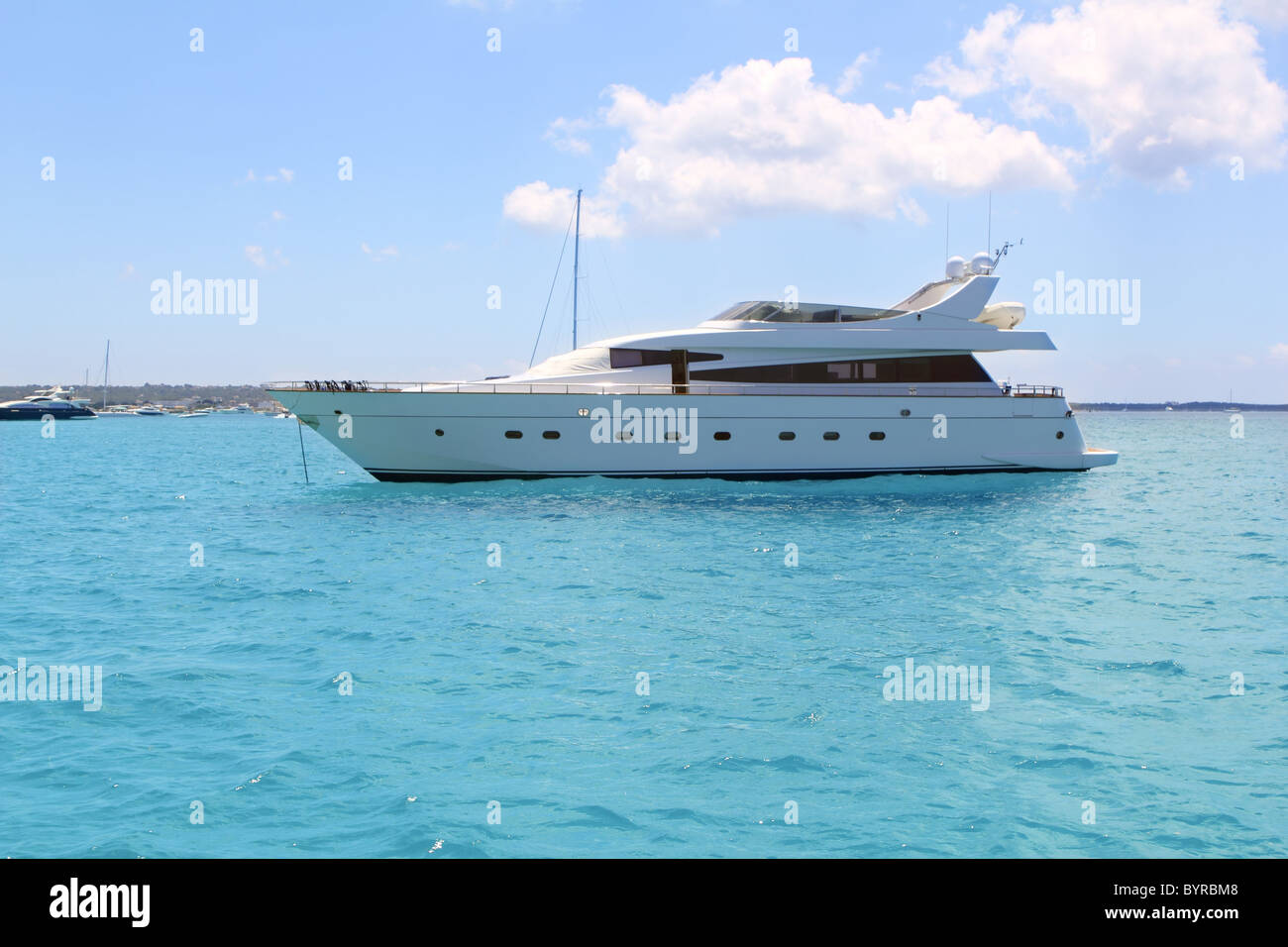 luxury yacht in turquoise Illetes Formentera mediterranean sea Balearic Islands Stock Photo