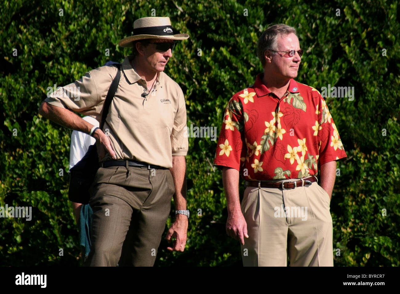 David Ledbetter, (left) and Mark Rolfing watch Michelle. Wie during a practice round prior to The 2005 Sony Open In Hawaii. Stock Photo