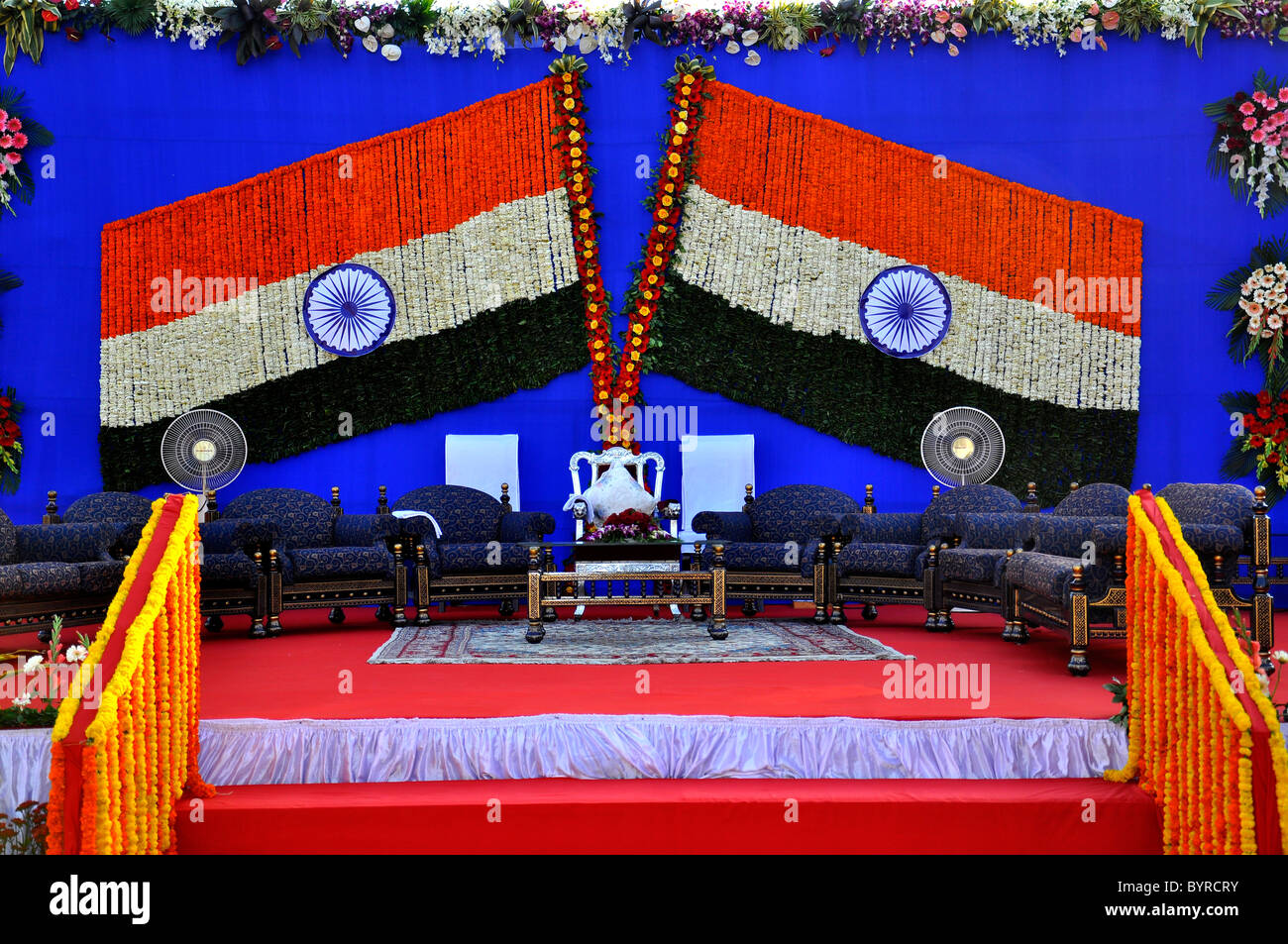 A stage with two Indian national flags ( made up of flowers) Stock Photo
