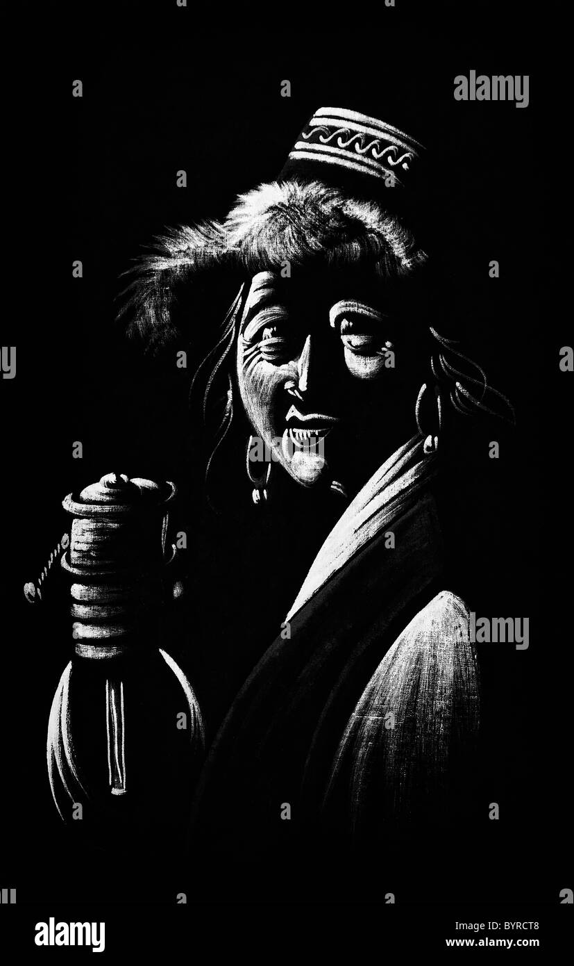 Black and white old Tibetan woman with prayer wheel painting on fabric. India Stock Photo