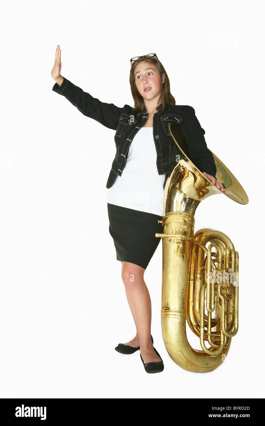 a girl with a tuba holding her hand out to stop; portland, oregon