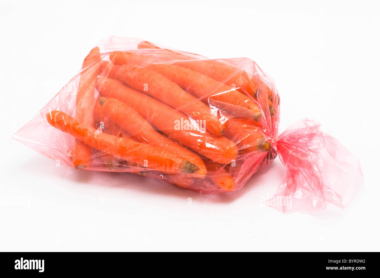 Download Carrot In Plastic Bag On White Background Stock Photo Alamy Yellowimages Mockups