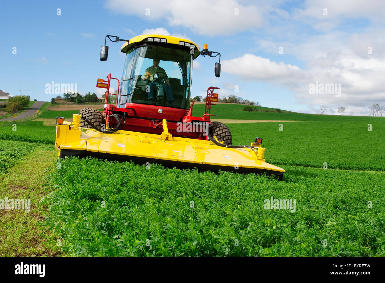 Agriculture A self propelled New Holland Discmower silage harvester