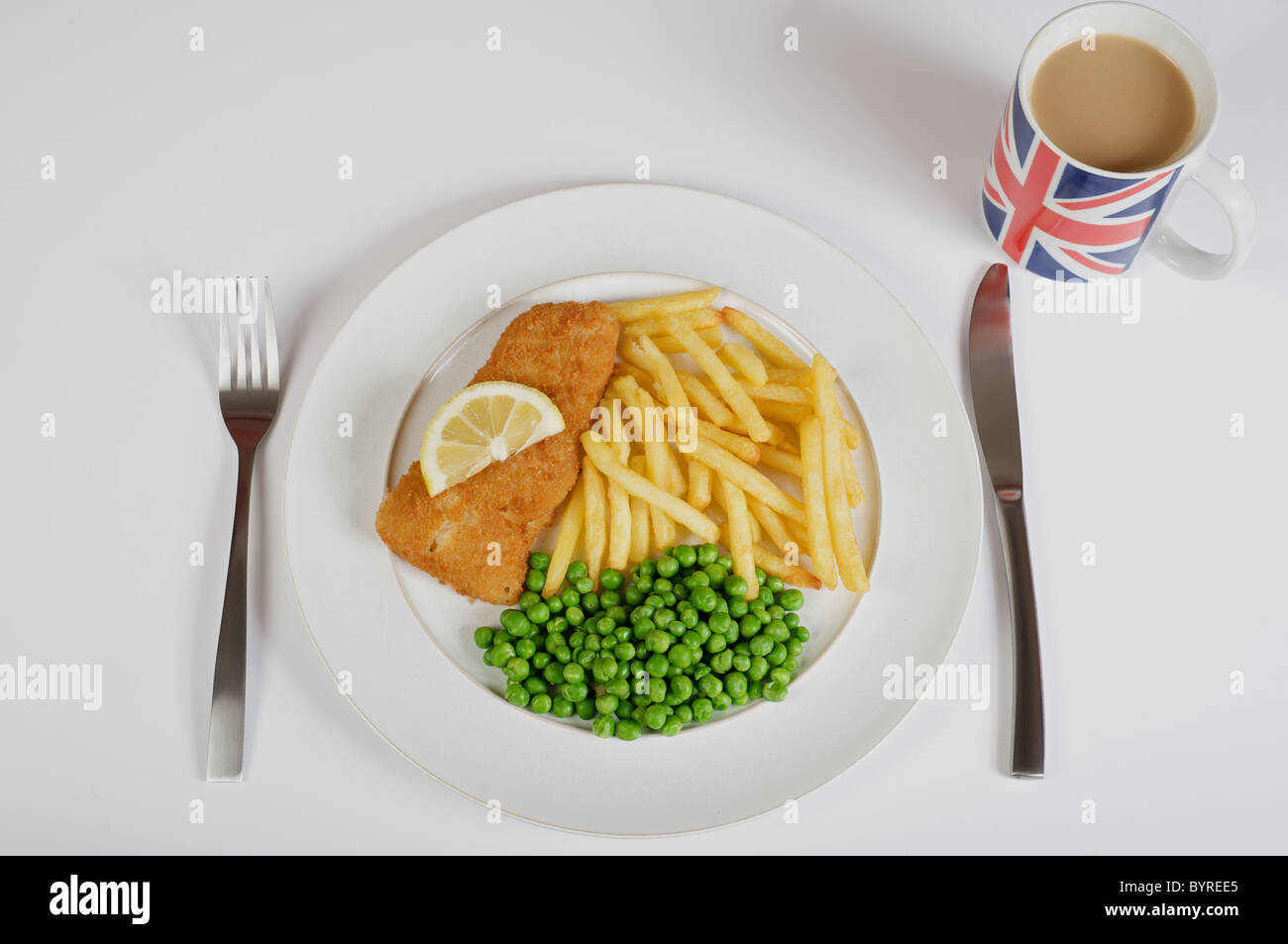 Fish, chips and peas with cup of tea. Stock Photo