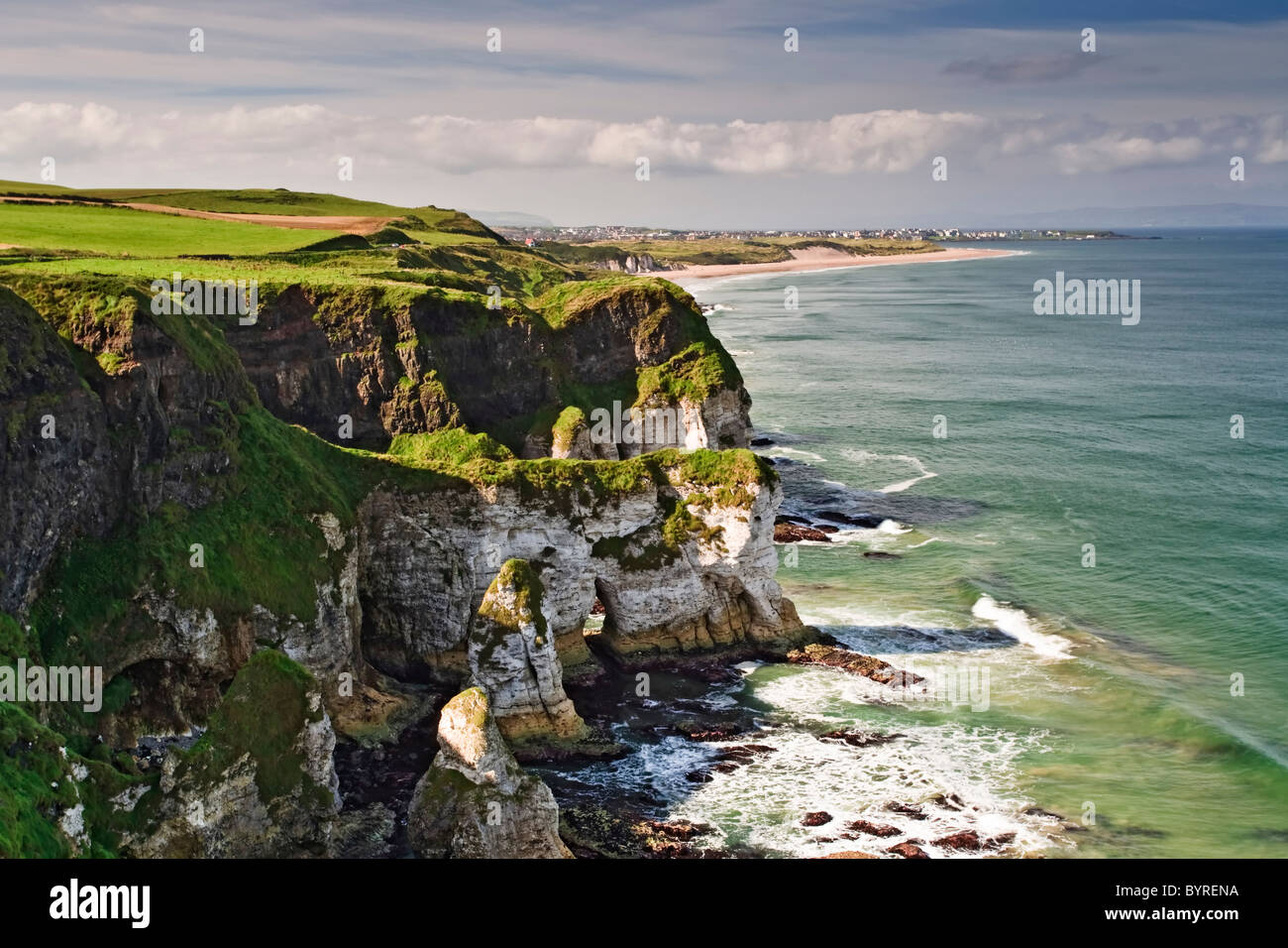 The chalk cliffs of Burnfoot looking toward the town of Portrush, County Antrim, Northern Ireland Stock Photo