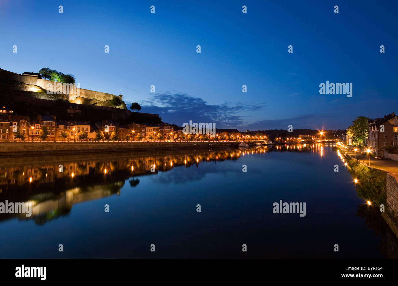 Namur by night - with the citadel reflecting in the Meuse River Stock Photo